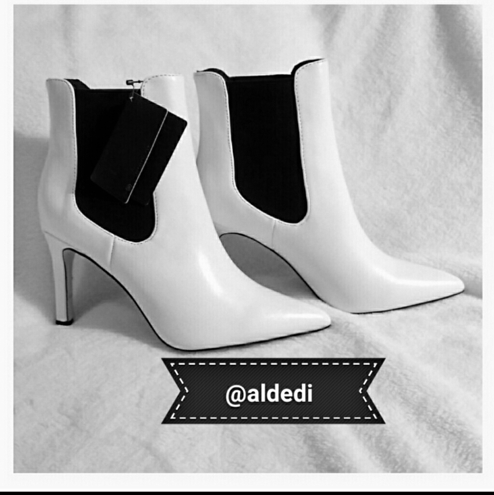 Booties  White and Black pointed Toe.